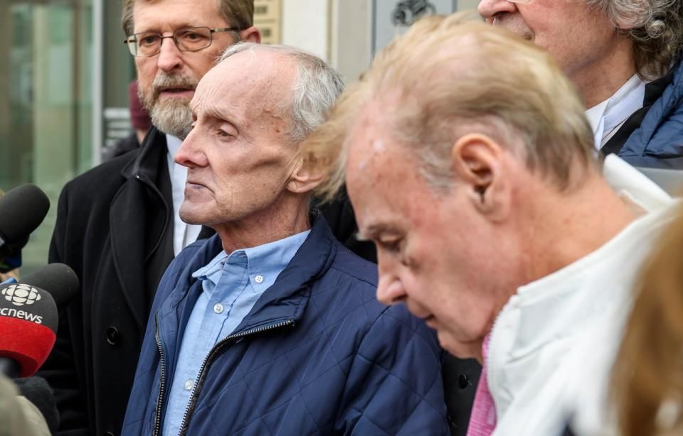 Robert Mailman, left, and Walter Gillespie, speak to media shortly after their hearing at Saint John Law Courts in Saint John, N.B., January 4, 2024. The two men recently had a 1984 murder conviction overturned and have now been found formally not guilty.