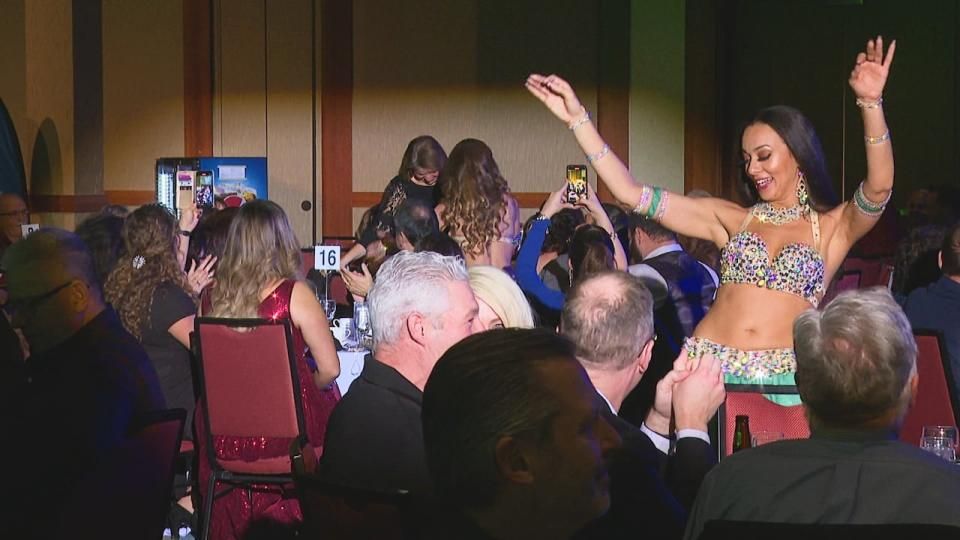A belly dancer mingles with the crowd at the Lebanese levee Saturday night at the Delta Prince Edward Hotel. (Stacey Janzer/CBC - image credit)