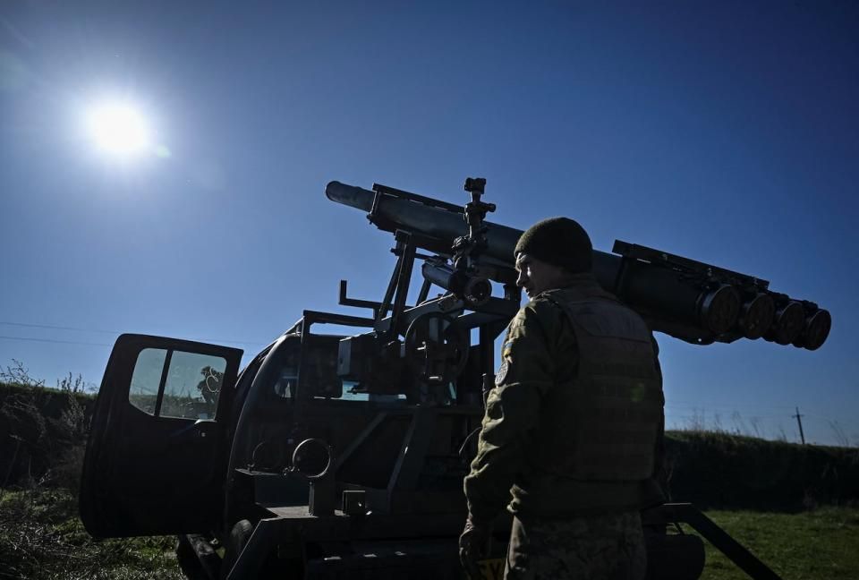 A Ukrainian serviceman prepares a small multiple rocket launch system for firing on November 7, 2023. Canada is looking at donating surplus air-to-ground rockets to Ukraine. (Reuters - image credit)