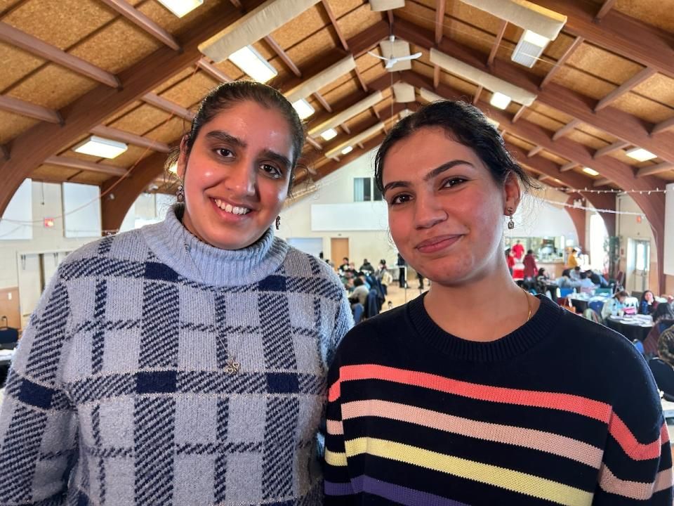 Ananya Kaur and Navpreet Juara, both from India, were among 150 international students at a conference Saturday to learn about resources available to them after graduation. (Stacey Janzer/CBC - image credit)