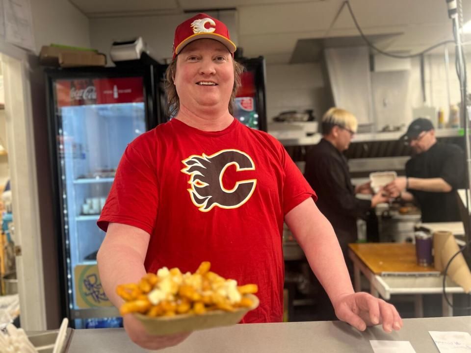 Tim Cameron heads up the concession stand at the hockey tournament. He estimates he'll serve upwards of 1,800 orders of poutine this weekend.