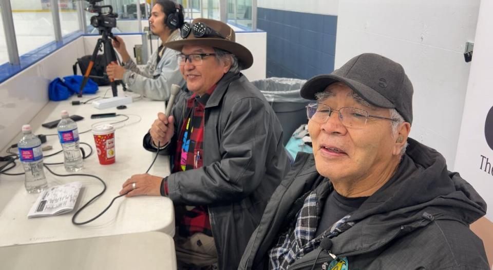 Brothers Hammond Dick and Testloa Smith are broadcasting some of the tournament games in Kaska. To do so they translated 20 pages of hockey terms into Kaska. (George Maratos/CBC News - image credit)