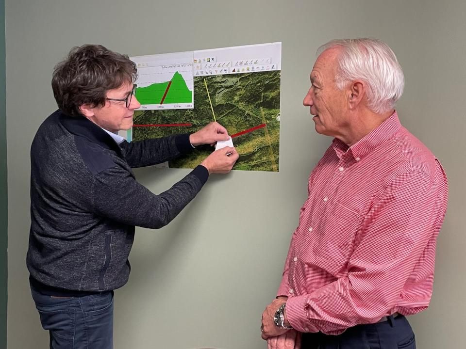 Guy Rousseau (left) and Réjean Carrier (right) explain the deposit of pozzolan they've identified through geological analysis in the Dalhousie area of northern New Brunswick.