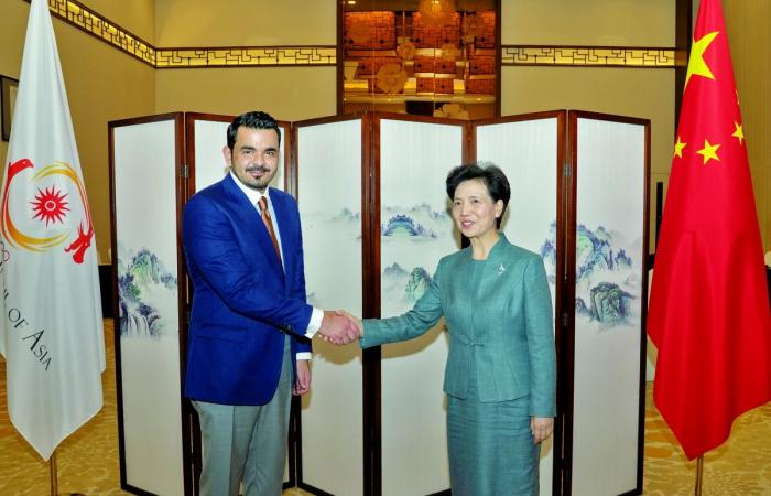 رئيس المجلس الأولمبي الآسيوي يجتمع مع عضو مجلس الدولة بالصين